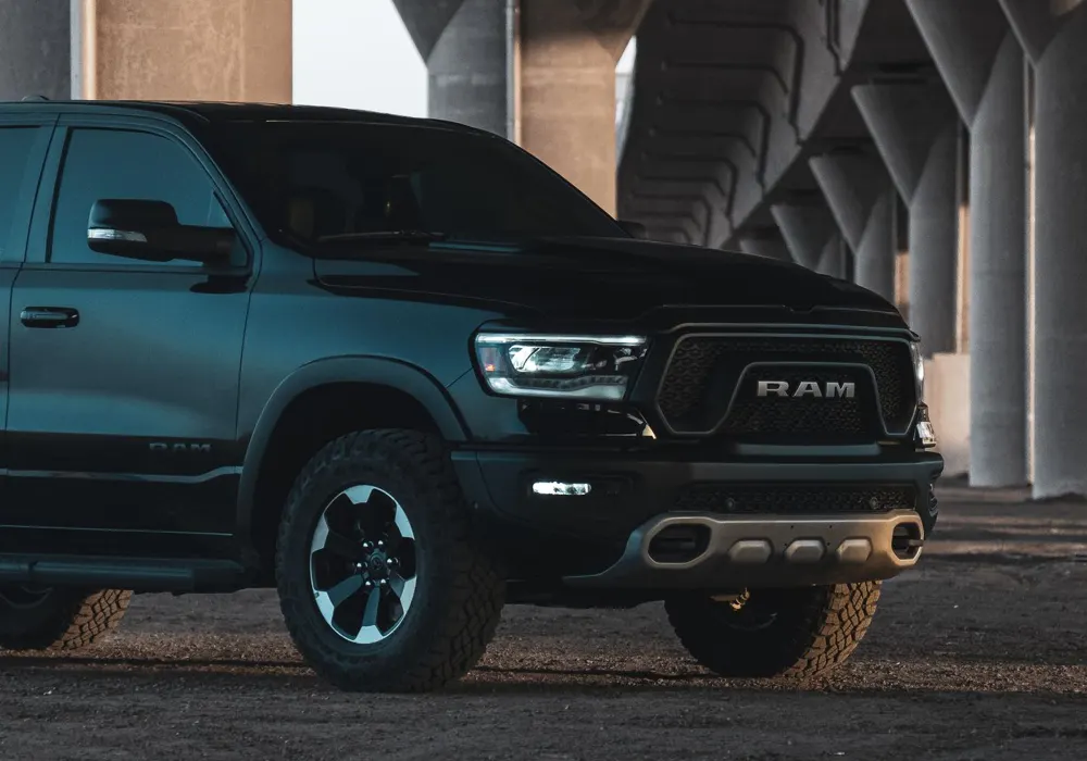 RAM pickup under an urban overpass